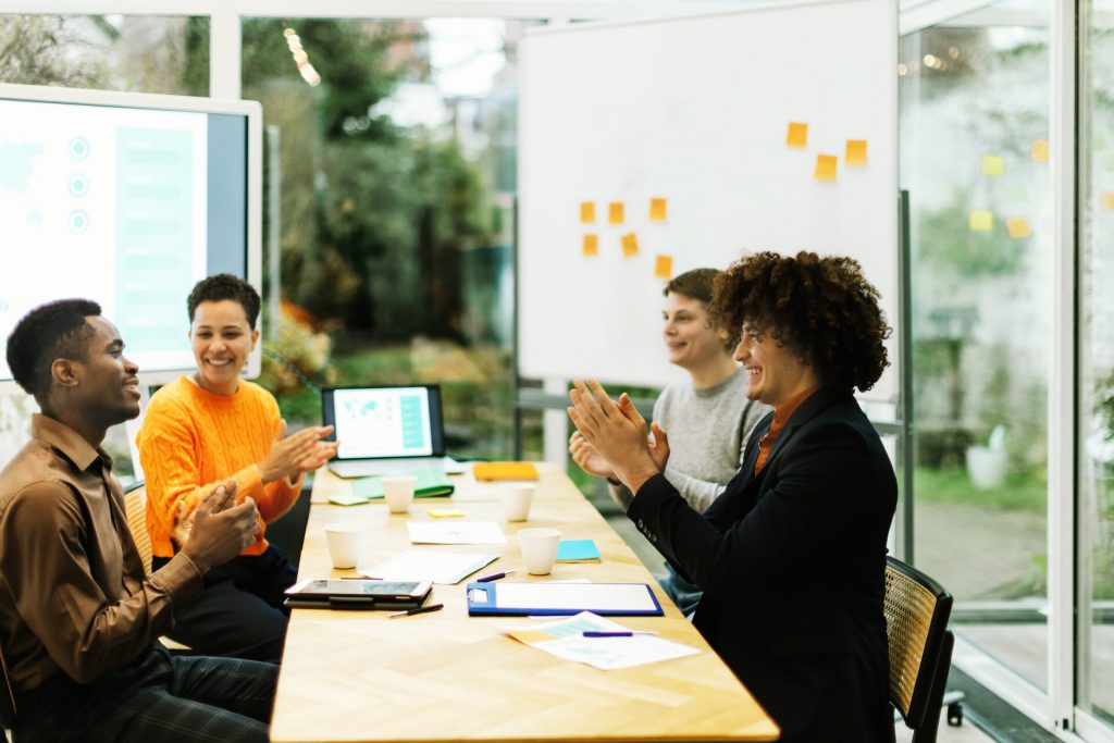 group of positive colleagues at work in the office